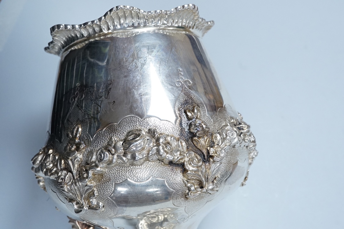 A continental white metal (stamped 0.925) ewer, decorated with floral garlands, height 28cm, 25.4oz.